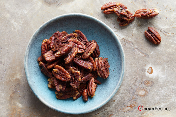 The Sweet and Spicy Pecans is considered the perfect dish to serve with cocktails or toss over the salads, and one of the best parts of this dish is that they take just fifteen minutes to make it. Moreover, keto sweet and spicy pecans are very delicious and yummy. Ingredients: Half cup Confectioners' sugar 3/4 tbsp of kosher salt Half teaspoon common cayenne pepper Four teaspoons water Two cups pecans Recipe of candied spiced pecans stovetop: First of all, you have to preheat your oven to 350°F and set an oven rack in the middle position for the ease. Then line a simple baking sheet with the parchment paper. After that, take a medium-size bowl, and whisk together the confectioners’ sugar, kosher salt, cayenne pepper, and the water. Then, just add some pecans to your sugar mixture and also stir until the nuts are evenly coated here. Now you have to transfer the pecans to the previously prepared baking sheet and then arrange it in a single layer. You must do your best to make sure that the nuts are evenly spread out. After that, scrape out every last bit of the glaze from the simple bowl and then drizzle over the nuts. Then, bake it for ten to twelve minutes, until your pecans are caramelized and then the caramel on the baking sheet is a rich brown color but it must not burn. You will observe that the nuts around its edges will darken first; so you must watch closely so they don't burn. After that immediately slide the simple parchment off of the baking sheet and then just allow the pecans to cool fully on the countertop. Once you have cool it, immediately remove the pecans from your parchment, breaking apart any clusters if it is necessary, and store in an airtight container for almost two weeks. In the end, if your nuts are sticky after the cooling, it means that they are a bit undercooked. So, you need to pop them back in your oven for a few minutes and let it cool again. Ingredients: One large size egg white Two cups unsalted pecan halves Two cups unsalted roasted cashews Half cup sugar One tablespoon ground cumin 3/4 teaspoon of the cayenne pepper Just one teaspoon ground cinnamon Some of the kosher salt Method: Firstly preheat the oven to almost 250 degrees F. and then beat the egg white with the one tablespoon water in a large size bowl until it looks foamy. Then add the nuts, sugar, cumin, cayenne, cinnamon, and half teaspoon of the salt and mix it very well. After that, spread the mixture on the parchment-lined baking simple sheet. Now you have to bake until your nuts are mostly dry but still slightly sticky, just about forty minutes. After that, remove these nuts from the oven and stir it constantly. You can also reduce the temperature to two hundred degrees F. Then return the nuts to the oven and also bake it until crisp, about thirty minutes more. You have to stir to loosen the nuts from your baking sheet and cool it fully on the sheet.