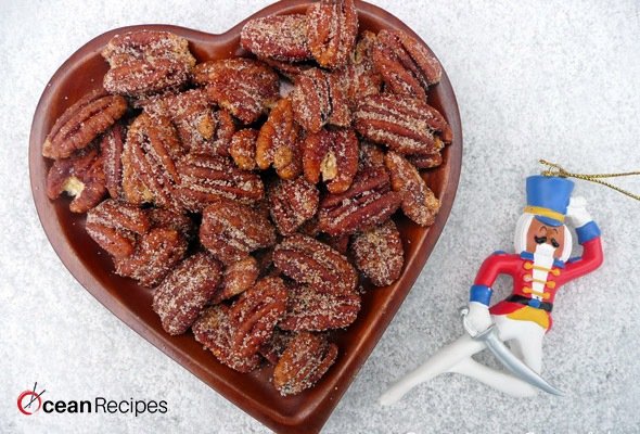 The Sweet and Spicy Pecans is considered the perfect dish to serve with cocktails or toss over the salads, and one of the best parts of this dish is that they take just fifteen minutes to make it. Moreover, keto sweet and spicy pecans are very delicious and yummy. Ingredients: Half cup Confectioners' sugar 3/4 tbsp of kosher salt Half teaspoon common cayenne pepper Four teaspoons water Two cups pecans Recipe of candied spiced pecans stovetop: First of all, you have to preheat your oven to 350°F and set an oven rack in the middle position for the ease. Then line a simple baking sheet with the parchment paper. After that, take a medium-size bowl, and whisk together the confectioners’ sugar, kosher salt, cayenne pepper, and the water. Then, just add some pecans to your sugar mixture and also stir until the nuts are evenly coated here. Now you have to transfer the pecans to the previously prepared baking sheet and then arrange it in a single layer. You must do your best to make sure that the nuts are evenly spread out. After that, scrape out every last bit of the glaze from the simple bowl and then drizzle over the nuts. Then, bake it for ten to twelve minutes, until your pecans are caramelized and then the caramel on the baking sheet is a rich brown color but it must not burn. You will observe that the nuts around its edges will darken first; so you must watch closely so they don't burn. After that immediately slide the simple parchment off of the baking sheet and then just allow the pecans to cool fully on the countertop. Once you have cool it, immediately remove the pecans from your parchment, breaking apart any clusters if it is necessary, and store in an airtight container for almost two weeks. In the end, if your nuts are sticky after the cooling, it means that they are a bit undercooked. So, you need to pop them back in your oven for a few minutes and let it cool again. Ingredients: One large size egg white Two cups unsalted pecan halves Two cups unsalted roasted cashews Half cup sugar One tablespoon ground cumin 3/4 teaspoon of the cayenne pepper Just one teaspoon ground cinnamon Some of the kosher salt Method: Firstly preheat the oven to almost 250 degrees F. and then beat the egg white with the one tablespoon water in a large size bowl until it looks foamy. Then add the nuts, sugar, cumin, cayenne, cinnamon, and half teaspoon of the salt and mix it very well. After that, spread the mixture on the parchment-lined baking simple sheet. Now you have to bake until your nuts are mostly dry but still slightly sticky, just about forty minutes. After that, remove these nuts from the oven and stir it constantly. You can also reduce the temperature to two hundred degrees F. Then return the nuts to the oven and also bake it until crisp, about thirty minutes more. You have to stir to loosen the nuts from your baking sheet and cool it fully on the sheet.